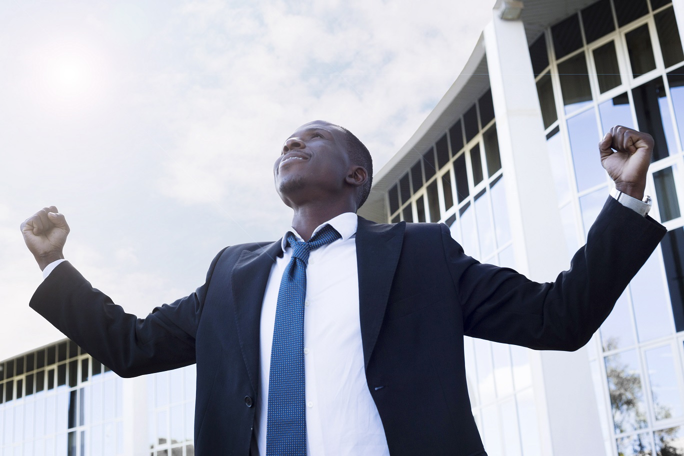 elegant-businessman-with-victory-pose